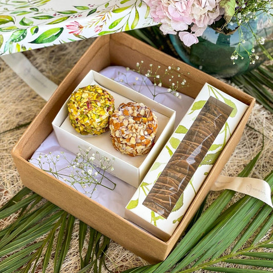 An image of a gift hamper including two cheese flavours and a mixed cracker box. A perfect gift for a birthday, housewarming, or dinner party