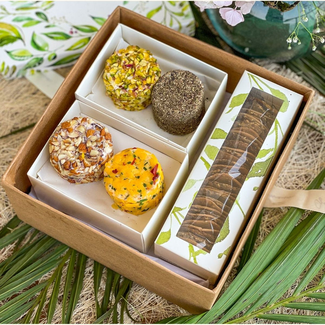 A gift hamper containing four cheese flavours and a mixed cracker box, unique cheese blends and wheat-free crackers make for the perfect gift.