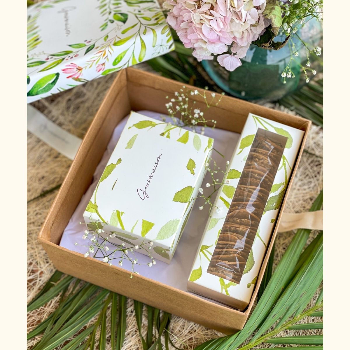 An image of a gift hamper including two cheese flavours and a mixed cracker box. A perfect gift for a birthday, housewarming, or dinner party  Edit alt text