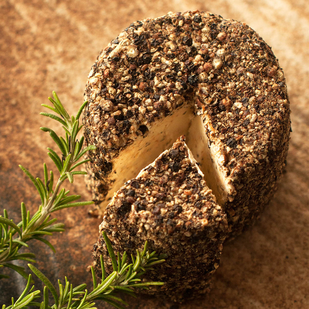 An image of herbs and pepper cheese in sizes of 75gms and 150gms, a soft cheese blended with fine herbs and coated with fresh black pepper.
