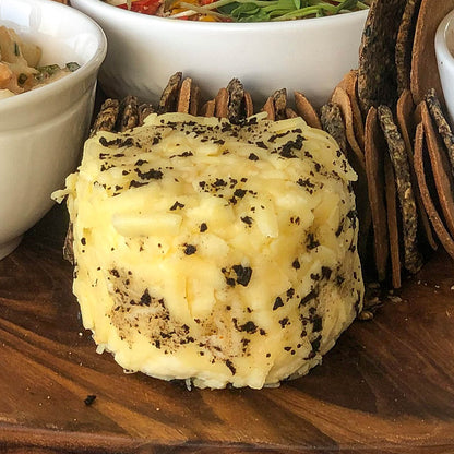 An image of Maison Truffle cheese in sizes of 75gms and 150gms, a cheese flavour for the truffle lover.