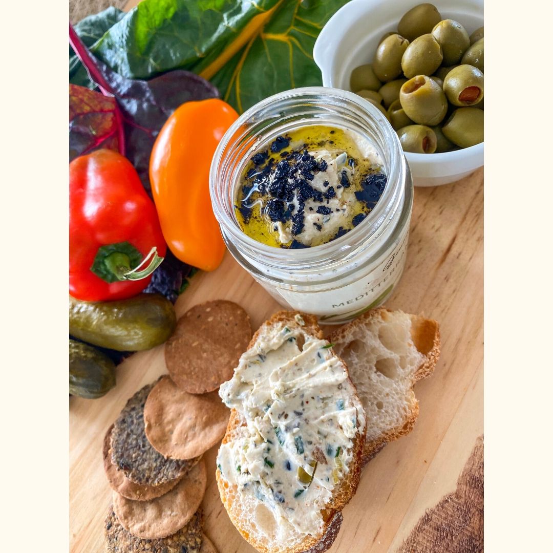An image of Mediterranean Spread in sizes of 170gms and 230gms, a smooth cheese spread with olives and herbs.
