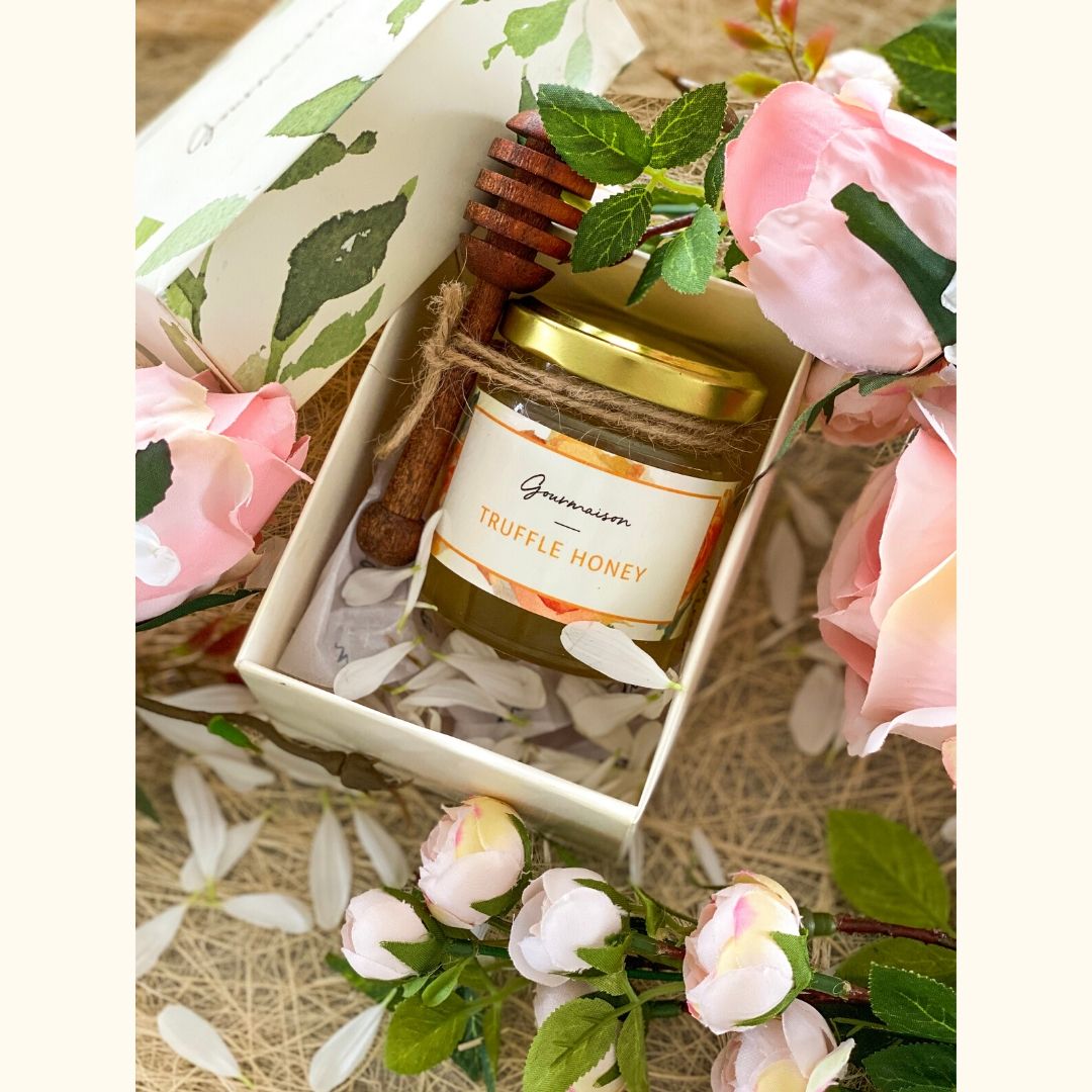 An image of the truffle edamame snow spread in sizes of 170gms and 230gms, a soft cloud of cheese with edamame and truffle. Available in a small gift box with a honey dipper. 