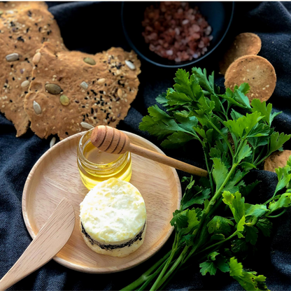 An image of the sea flakes cheese with truffle honey in the sizes of 75gms and 150gms, a slightly salty cheese that is paired with a smooth organic truffle honey