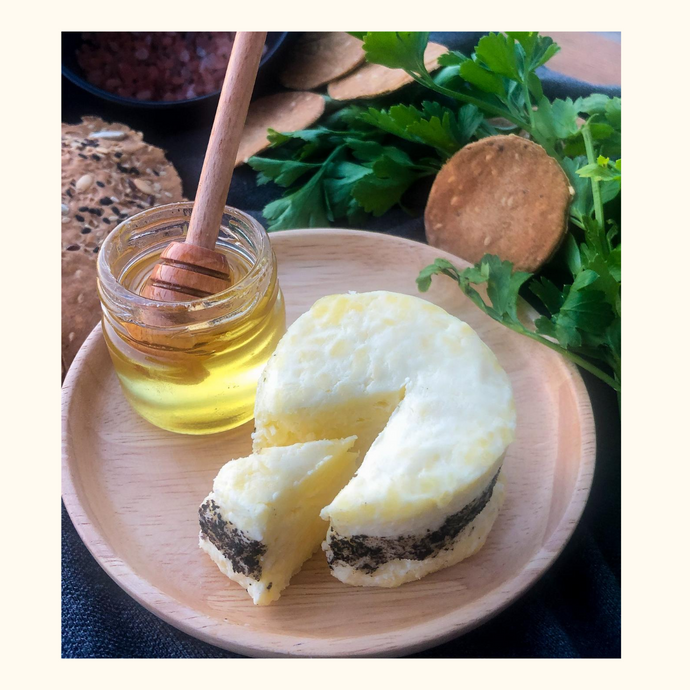 An image of the sea flakes cheese with truffle honey in the sizes of 75gms and 150gms, a slightly salty cheese that is paired with a smooth organic truffle honey